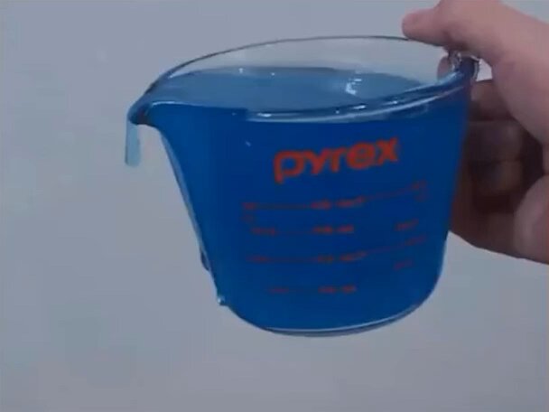 Polyethylene glycol is a liquid that can pour itself out of a container due to it's very long chains of linked molecules