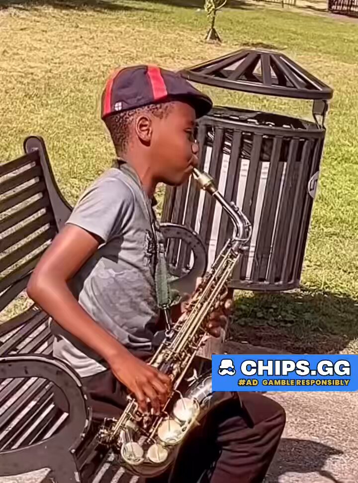 10-year-old saxophonist Jedidiah Olawunmi performing at a park in London, United Kingdom