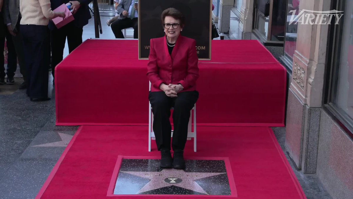 Billie Jean King poses for photos by her newly unveiled star on the Hollywood Walk of Fame.