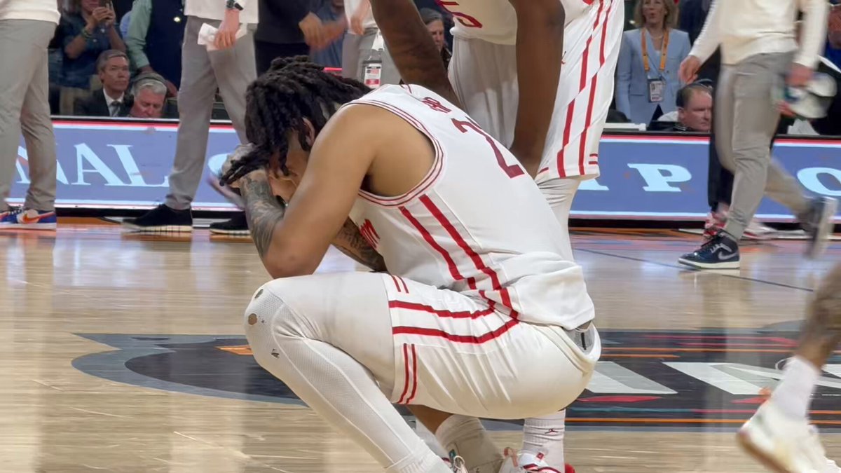 Emanuel Sharp consoled by Walter Clayton Jr. after the turnover.