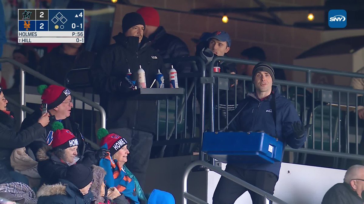 .Steve Gelbs gives out some hot chocolate to a man named George Metz ☕