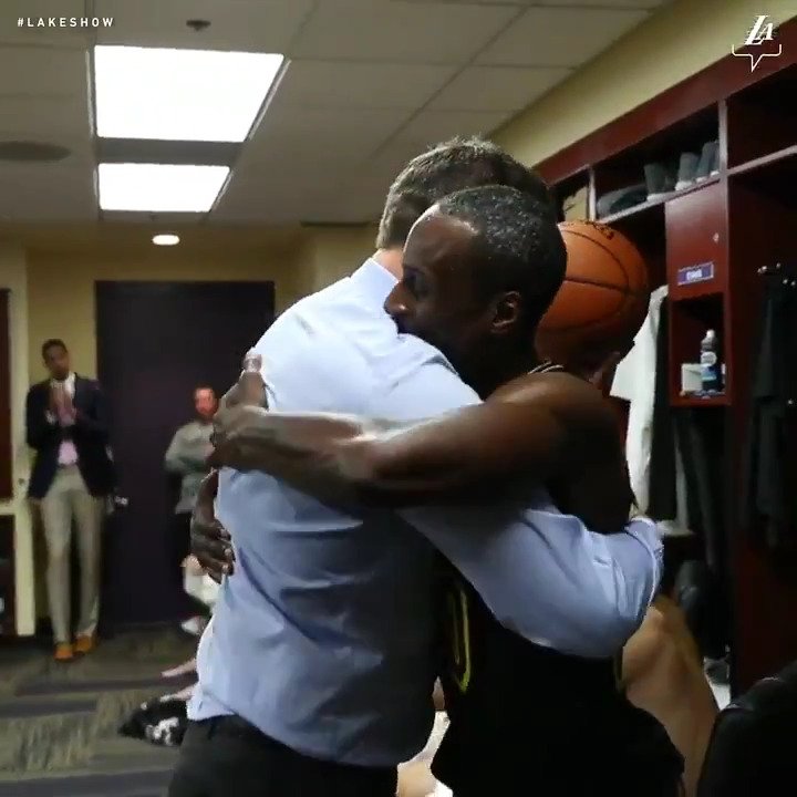 38-year-old Coach Luke Walton gives the game ball to 32-year-old rookie Andre Ingram