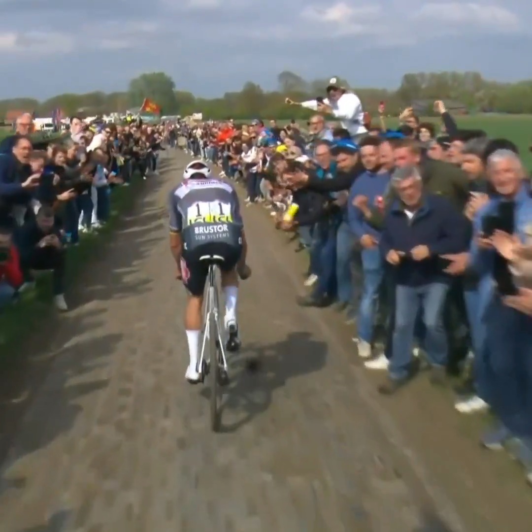 Spectator throws water bottle in Mathieu van der Poel's face at Paris-Roubaix. #ParisRoubaix