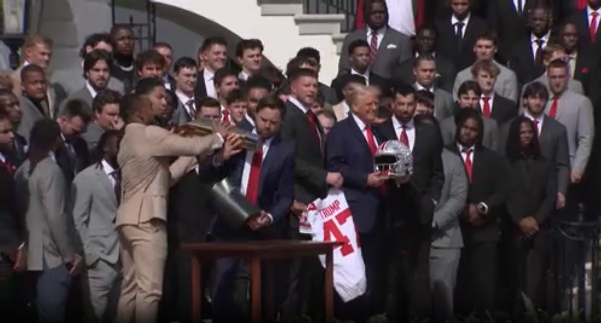 JD Vance drops Ohio State national championship trophy while Marine band plays "We are the Champions":