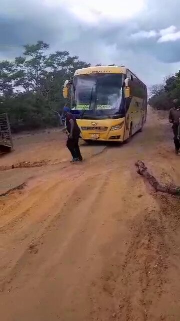 Road woes: Passengers capture harrowing footage of Extra City bus &amp; haulage truck stuck on Victoria Falls highway in Lupane. Drivers attempting to fix road with wood &amp; debris. When will the infrastructure get a much-needed upgrade?