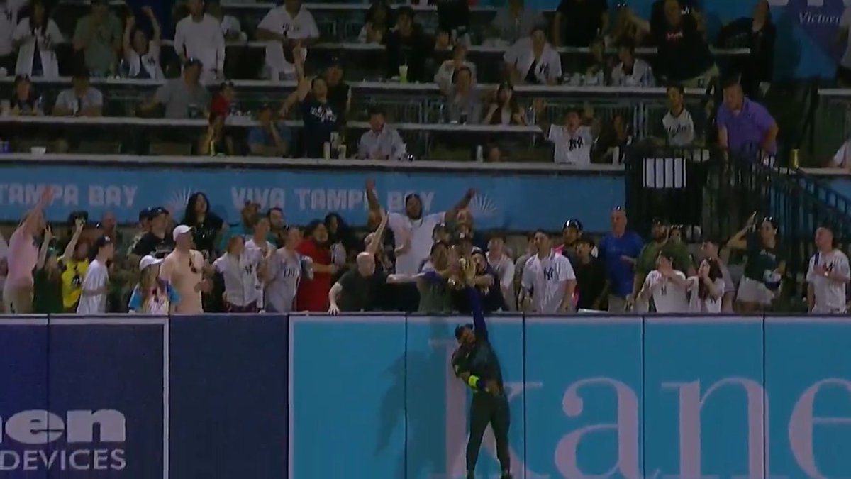 José Caballero gets WAY up to rob a home run! 🤯