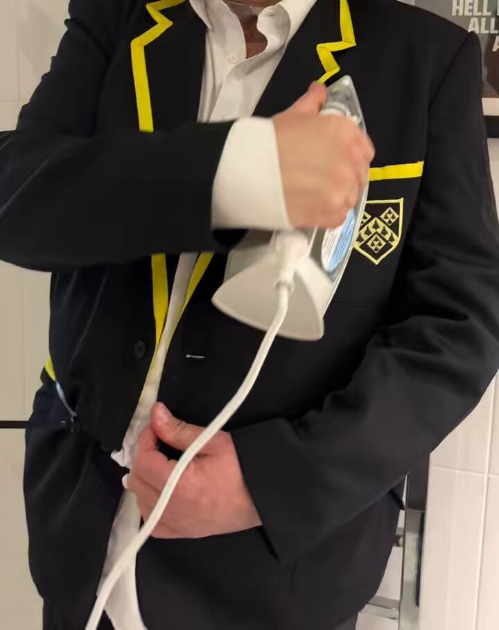 My slave tied to a hot radiator, wearing his uniform, and pressing himself with a hot iron.