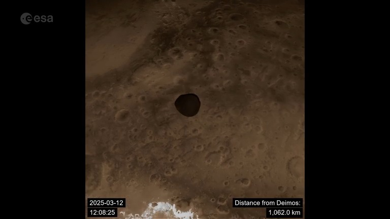 Flyby Mars with us! On 12 March 2025, our Hera spacecraft soared just 5000 km above Mars and passed within 300 km of its distant moon, Deimos. This video sequence offers a rare view of the red planet and its enigmatic moon. 🔗