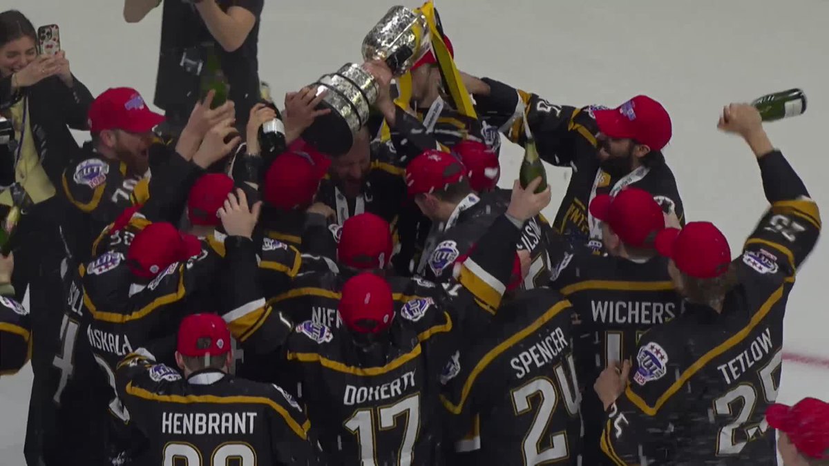 Sam Herr raises the trophy high and the champagne is uncorked! 🏆🍾 Congratulations, Nottingham Panthers! 👏 #EIHL | Elite Ice Hockey League | #EIHL
