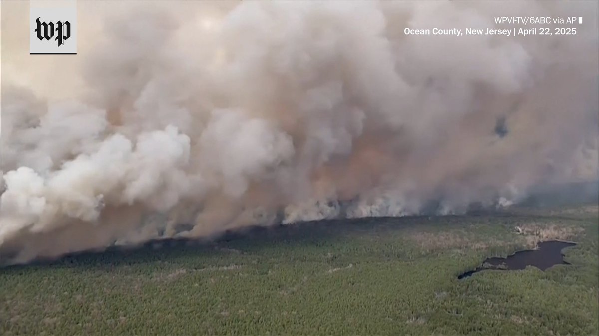 A destructive wildfire has erupted in eastern New Jersey, burning more than 8,500 acres as of Tuesday night, spurring thousands of evacuations and painting the sky bright red in parts of Ocean County.