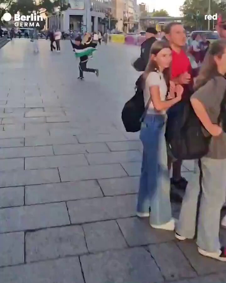 German Gestapo police chase down and arrest a child for daring to wave the Palestinian flag 🇵🇸 in protest of genocide in Gaza.