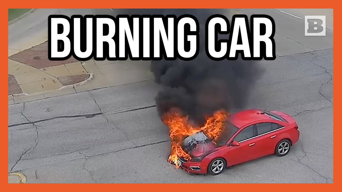 Cedar Rapids, Iowa: A car stopped in the middle of an intersection starts smoking and bursts into flames