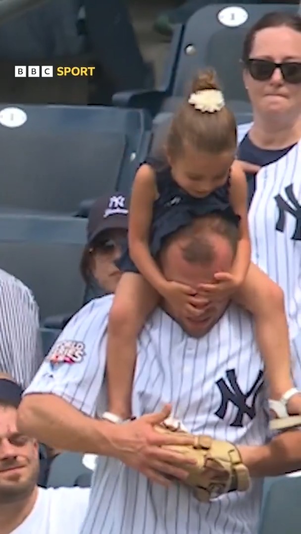 "That's Dad power right there". 🤣 An impressive catch from this Yankees fan, with a little obstacle. 👏