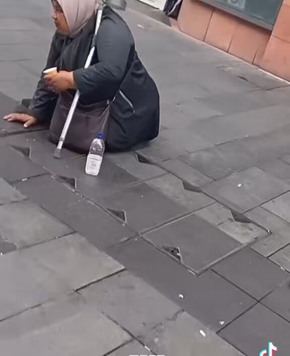 Leicester Roma Beggar who seems to be quite ill ( Shaking and the child sized crutch ) then a miracle occurs… she stops shaking and manages to spit and be aggressive towards the guy confronting her. Isn’t spitting at someone assault too ?