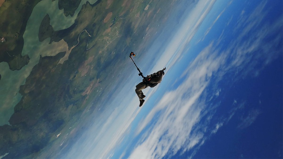 Tom Cruise has shared a new video of him jumping out of a plane.