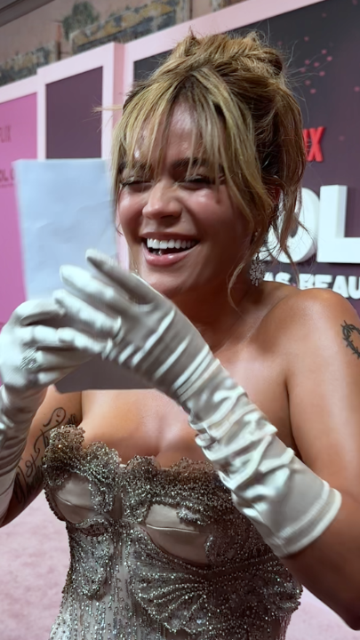 We surprised Karol G with the news that "SELENA Y LOS DINOS," a documentary about the queen of Tejano, is coming to Netflix later this year!
