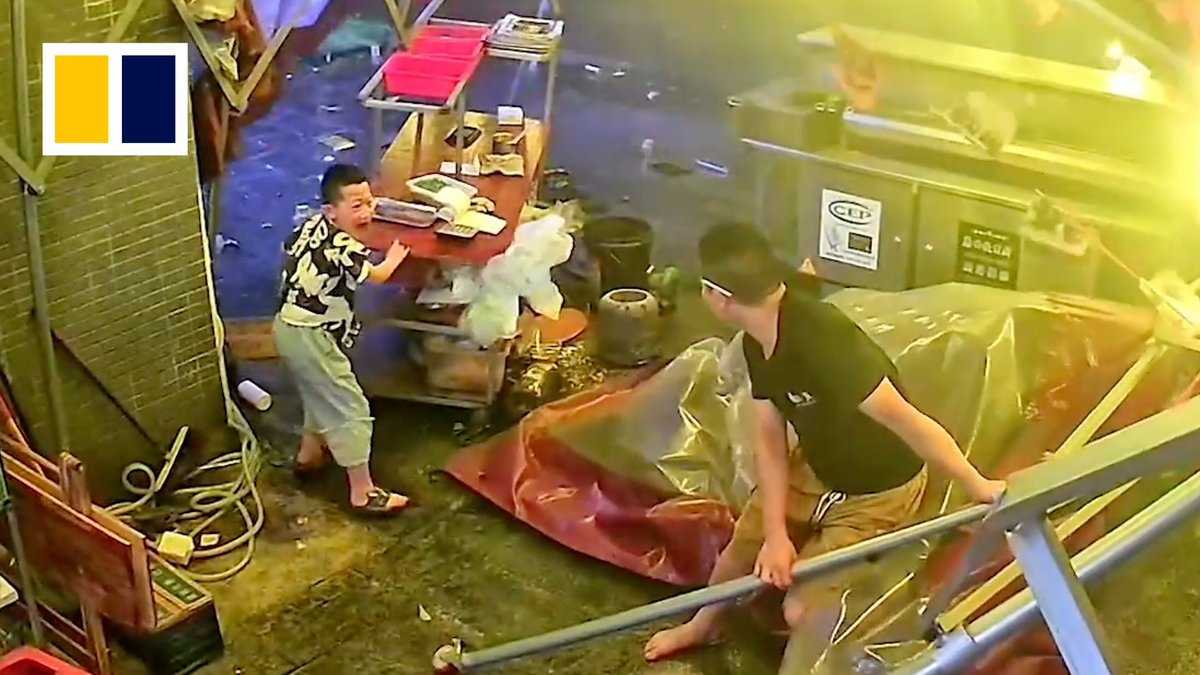 An eight-year-old boy helped to hold a food counter in place when powerful winds swept through the outdoor dining area of his parents’ barbecue restaurant in southwestern China.
