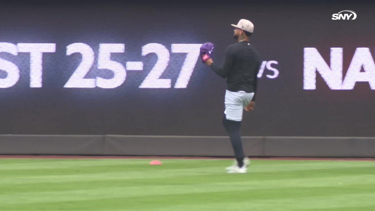 Luis Gil and Marcus Stroman toss at Yankee Stadium while Andy Pettitte watches on