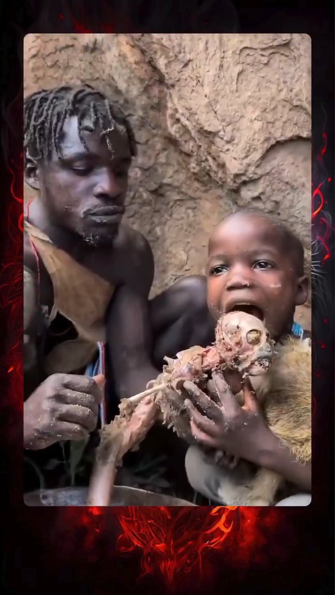 Tanzanian dad and son eating one of their own for lunch