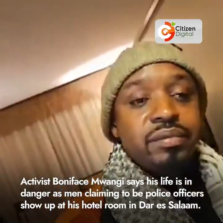Activist Boniface Mwangi says his life is in danger as men claiming to be police officers show up at his hotel room in Dar es Salaam, Tanzania