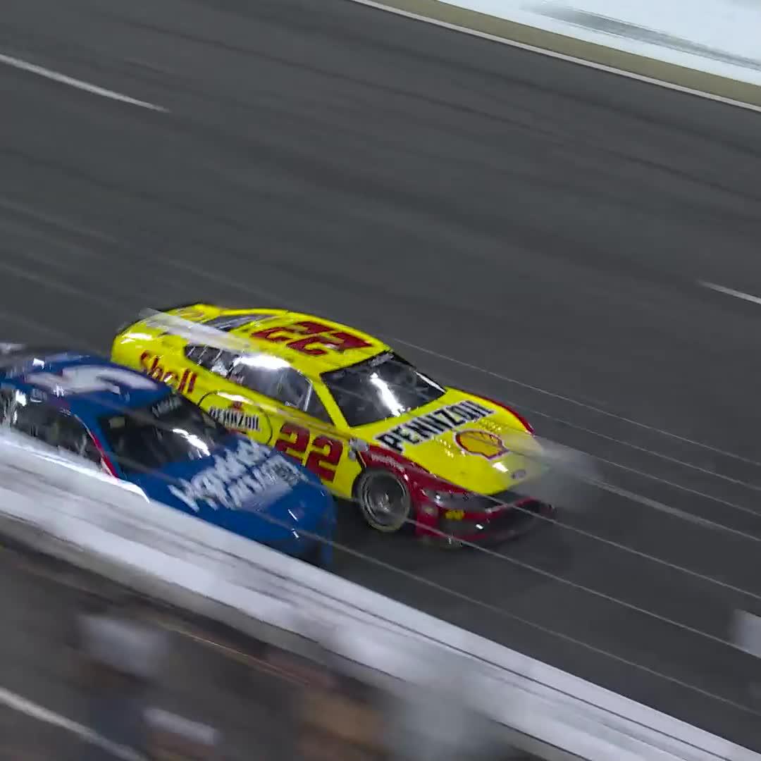 Larson is trying to make those two tires work, but here comes Logano again!