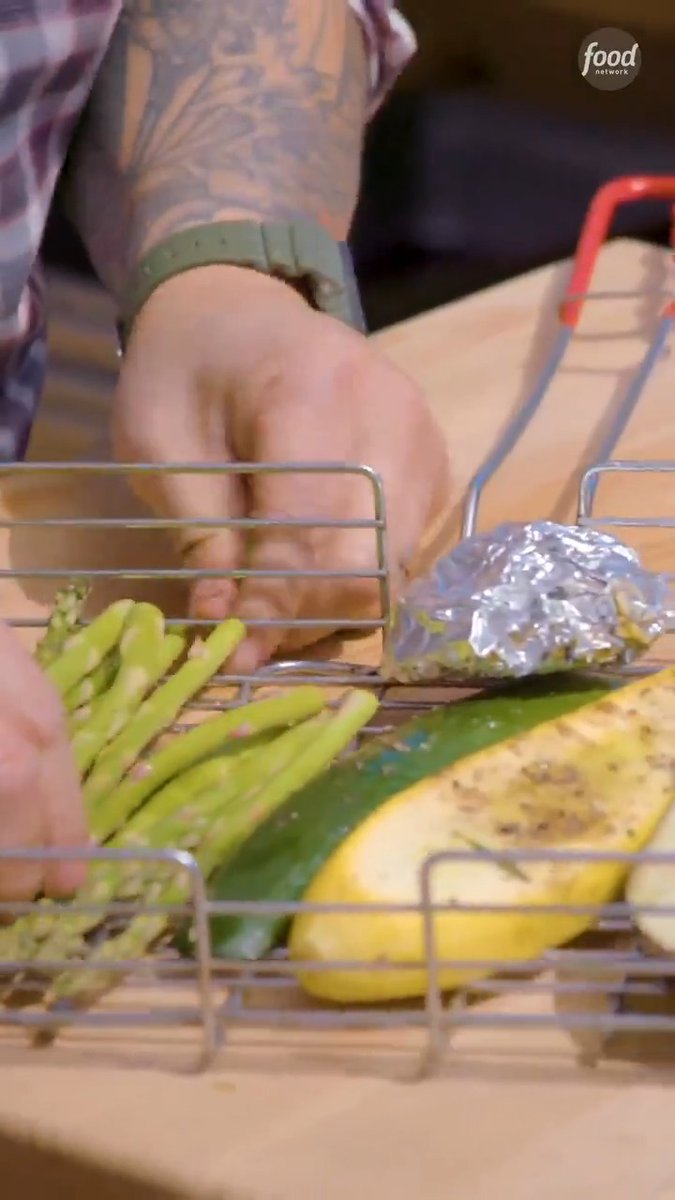 .Jet Tila uses a 2-in-1 grill basket to keep smaller veggies and delicate proteins from falling through the grill grates 🔥