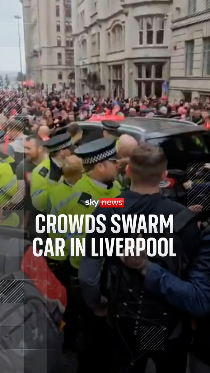 Footage shows the moments after a car ploughed into pedestrians in Liverpool - with crowds swarming around the car and hitting the windows as the police rush to respond.