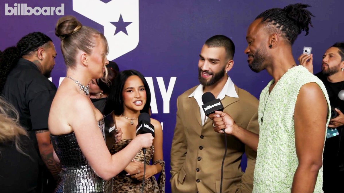 .Becky G and Manuel Turizo Zapata chat about wanting to party with J.Lo and Gloria Estefan, their collab "QUE HACES" and more on the #AMAs carpet. 🔥