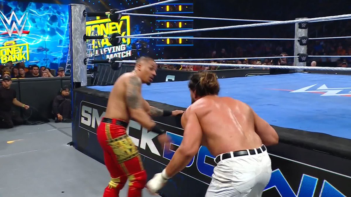 THROUGH THE BARRICADE!! This match is chaos 😳 #SmackDown