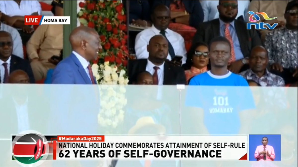 President Ruto presents 'jamaa wa kubonyeza kompyuta na Dola inaingia' with a home ownership title. #MadarakaDay2025