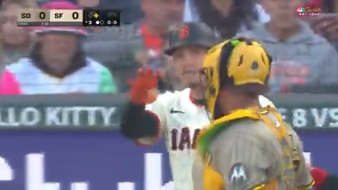 Wilmer Flores exchanges words with Padres pitcher Stephen Kolek after being hit by a pitch