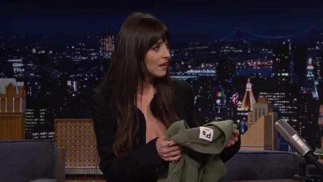 After Dakota Johnson’s dad gave Jimmy his sweater, Jimmy gifts it back to her in hopes she'll pass it along to her co-stars Pedro Pascal and Chris Evans 😂 #FallonTonight