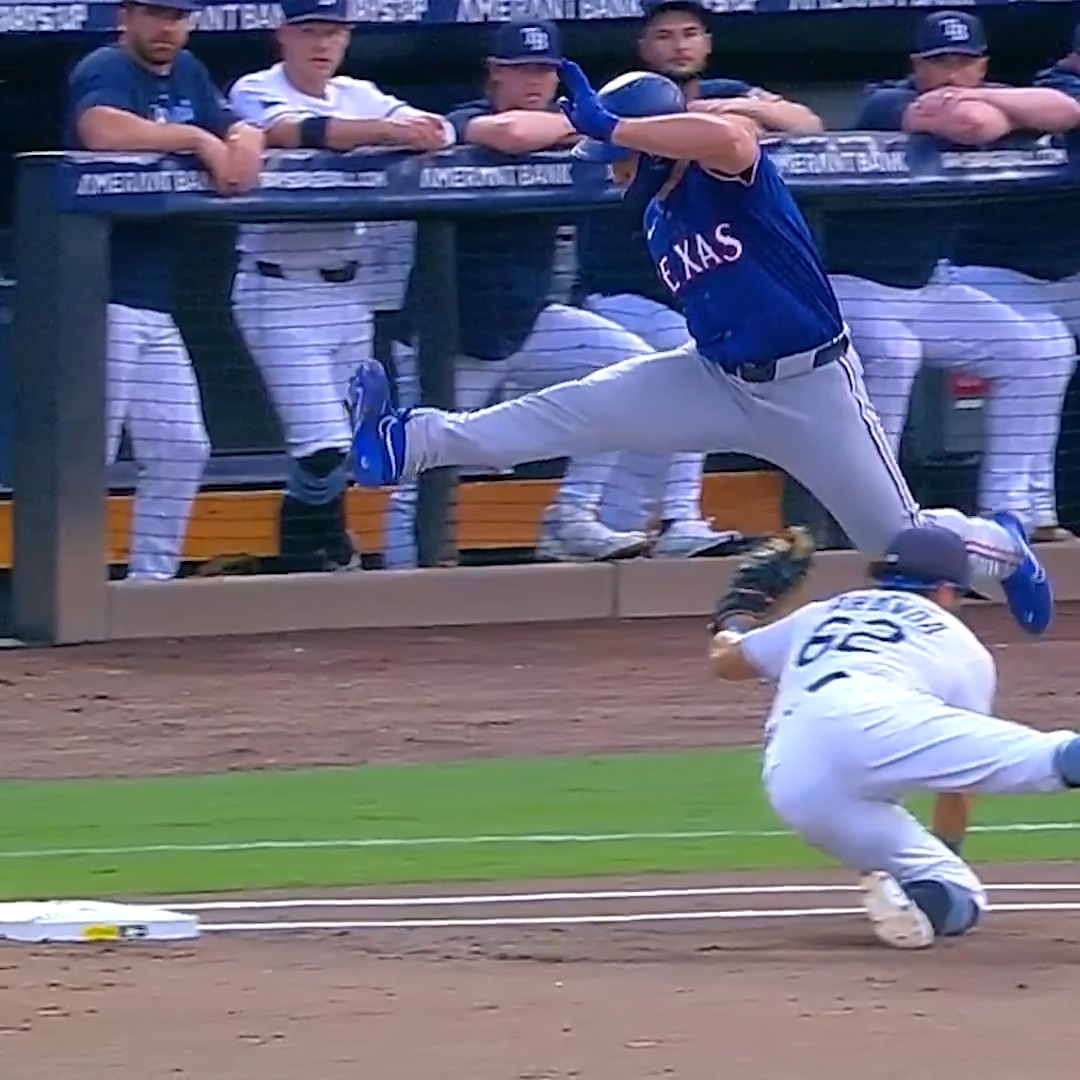 Wyatt Langford HURDLED him at first 😳 (via Texas Rangers)
