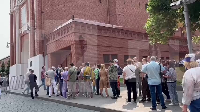 Russians line up to look at Lenin's corpse on the Red Square in Moscow.