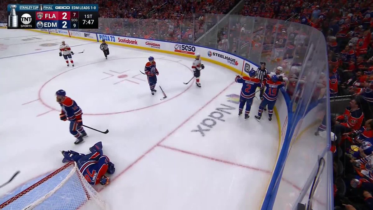 Sam Bennett is called for goalie interference on Stuart Skinner, who is being attended to by a trainer