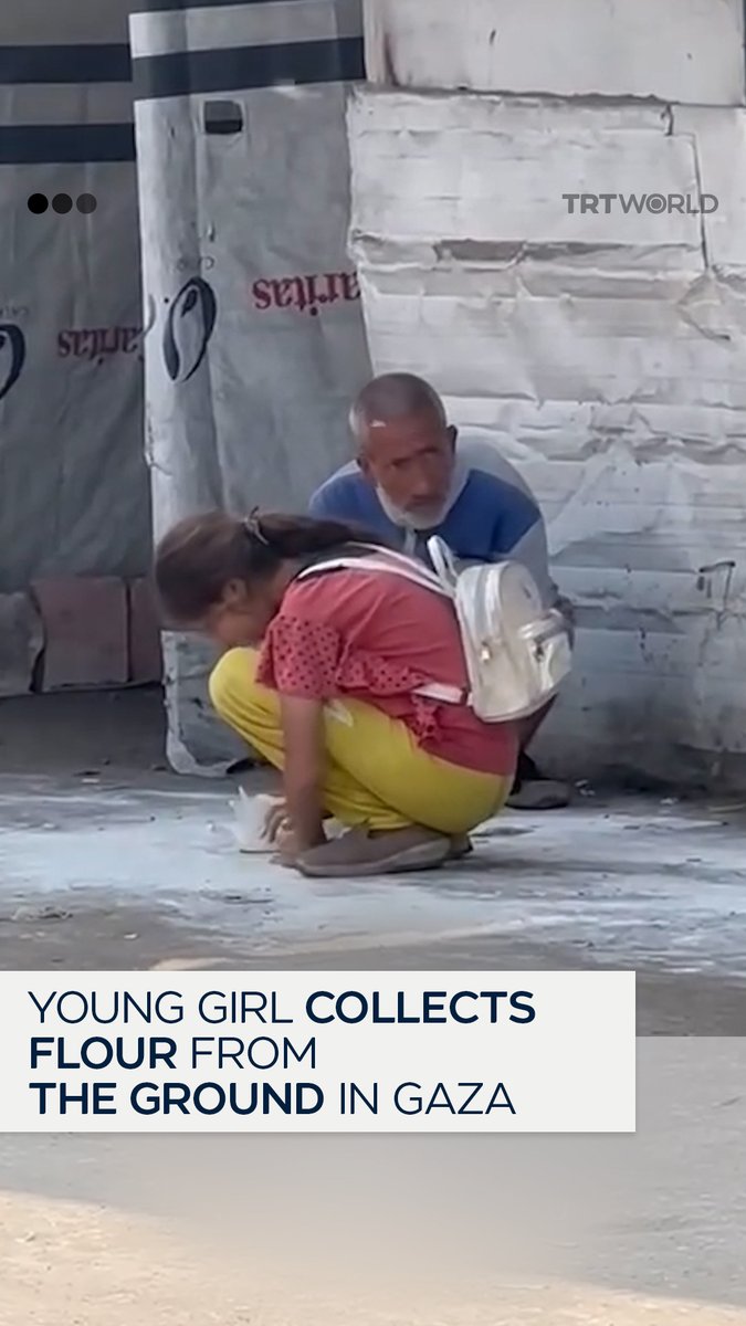 On the day of Eid al Adha, a young girl in Gaza is seen gathering scraps of flour from the ground beside her father — a stark image of the severe famine caused by Israel’s blockade of humanitarian aid. This marks the fourth consecutive Eid that Palestinians in Gaza have spent under Israeli bombardment, where celebration has been replaced by survival