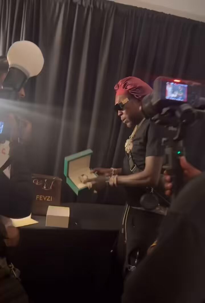 21 Savage gifts Vybz Kartel a Rolex watch backstage