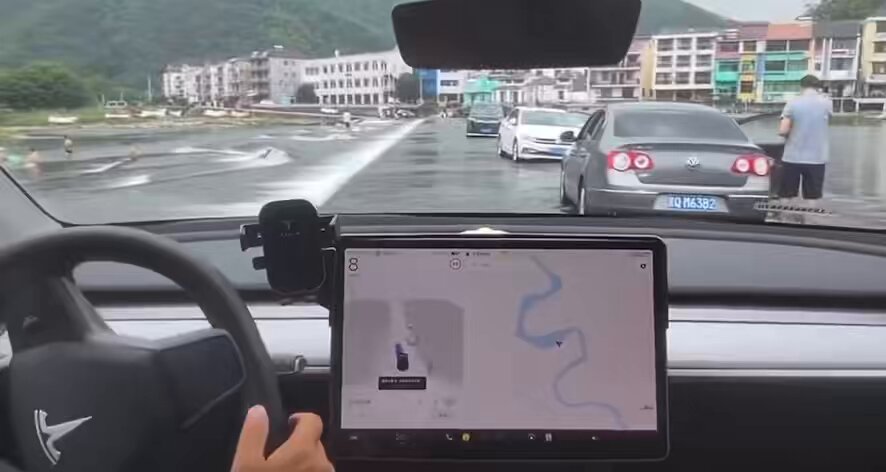 Tesla FSD driving on a road through the middle of a river with flowing water in China. Tesla AI is incredible. Waymo could never do this.