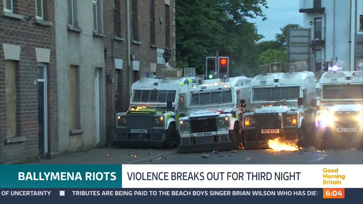 Petrol bombs have been thrown at police and a leisure centre set on fire - as riots continued for a third night in Northern Ireland. Officers used water cannons to disperse crowds in Ballymena. @swainitv reports.