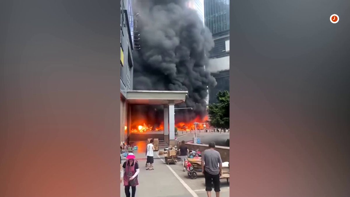 A large fire broke out and thick black smoke billowed from a motorcycle parking facility in China's Chongqing