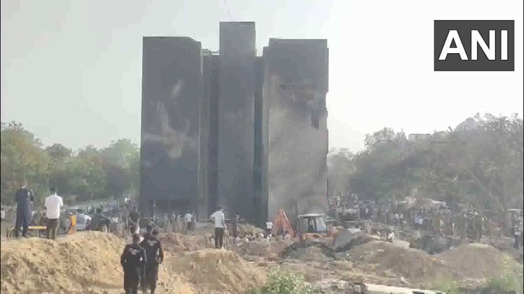 #WATCH | Ahmedabad Plane Crash | Visuals from the doctors' hostel where the London-bound Air India flight crashed. The tail fin of the aircraft seen on the premises.
