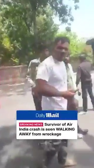 Survivor of Air India crash is seen walking away from the wreckage.