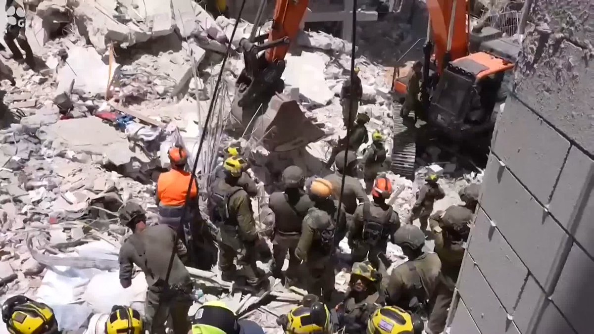 Benjamin Netanyahu visits the site of an Iranian missile strike at Bat Yam, south of Tel Aviv