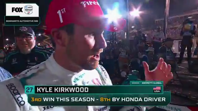 Kyle Kirkwood talks with Georgia Henneberry after his first career oval win.