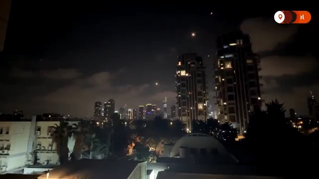Missiles are seen streaking through the night skies as the Iran-Israel air war enters its sixth day