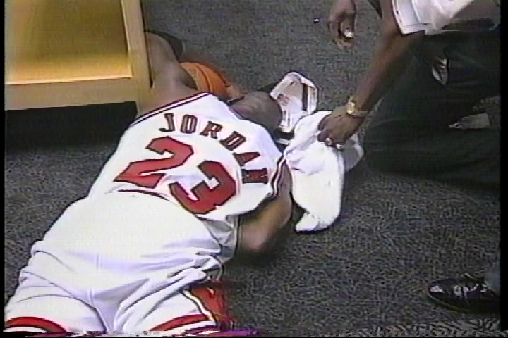 Michael Jordan collapses to the floor in the locker room, clutching the game ball, sobbing uncontrollably. Not just from victory… but from pain, release, and love. And in the postgame interview, he dedicates the trophy to his dad.