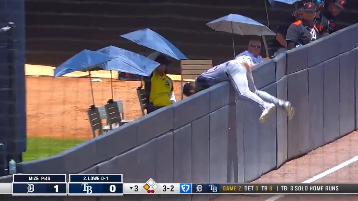 Riley Greene goes OVER the side wall to make the catch! 😱