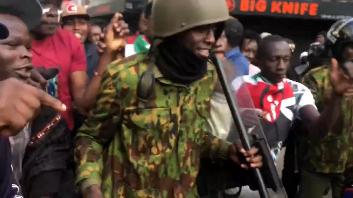 One thing I like about Gen Z protesters is that they're always peaceful. Notice how they're protecting the cop?
