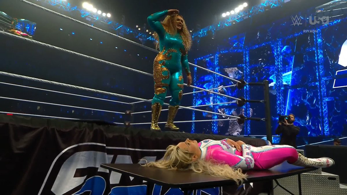 THROUGH THE TABLE! How did Tiffany Stratton survive that? 😳