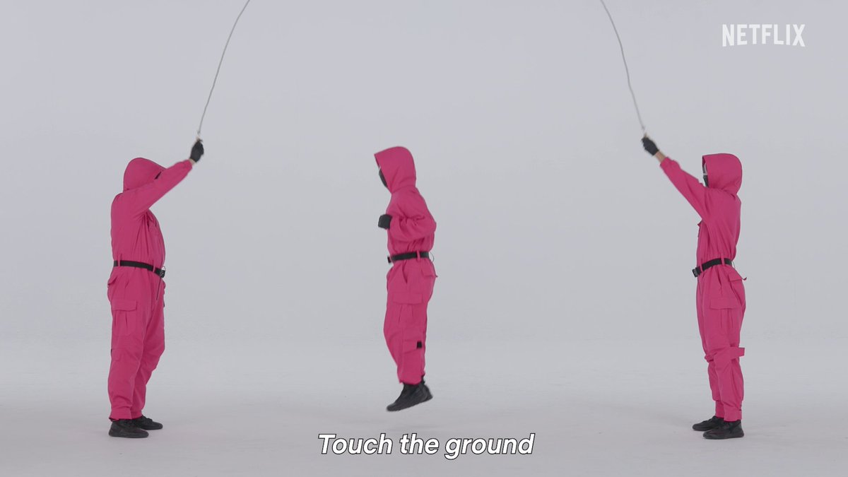 The Pink Guards are here to teach you how to play jump rope, Squid Game-style.